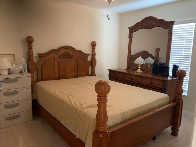 bedroom featuring light carpet