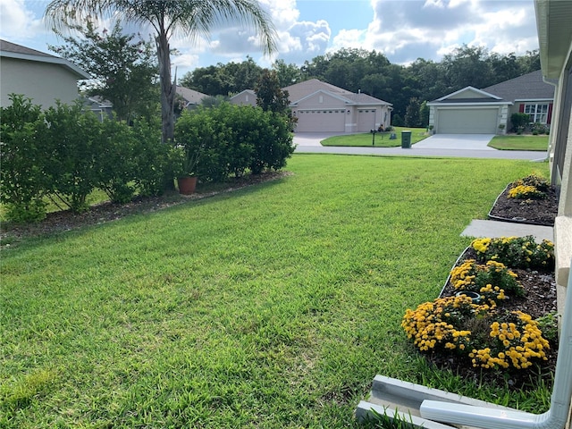 view of yard featuring a garage