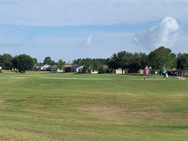 view of home's community with a lawn