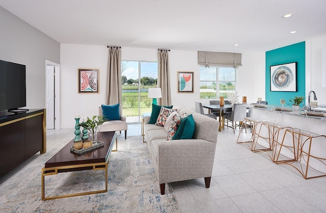 living room featuring light tile patterned floors and recessed lighting