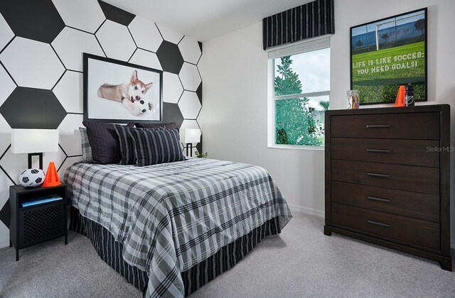 bedroom with baseboards and carpet flooring