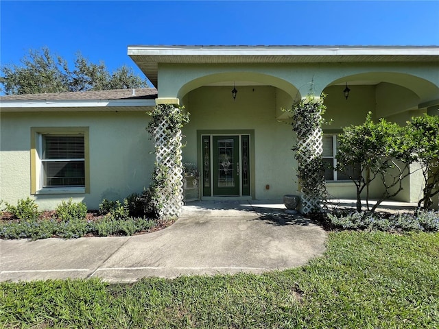 doorway to property with a patio