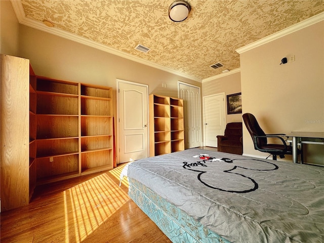 bedroom featuring ornamental molding and wood-type flooring