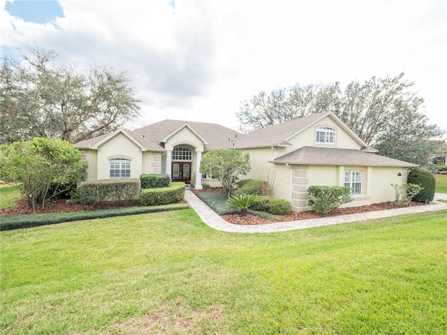 ranch-style house with a front lawn