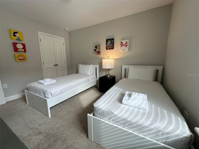 bedroom featuring carpet floors and a closet