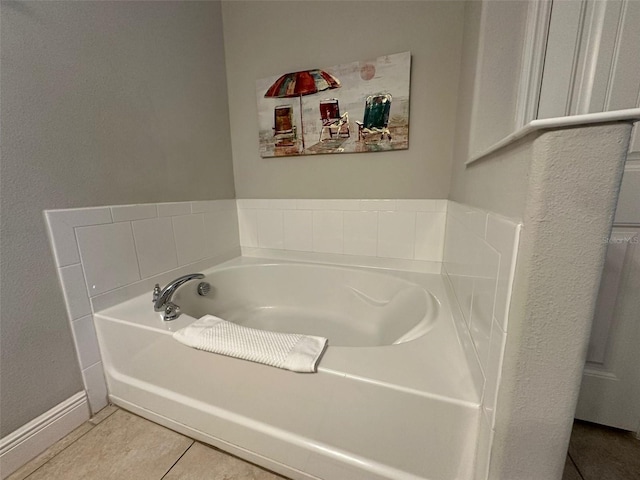 bathroom featuring tile patterned floors and a tub