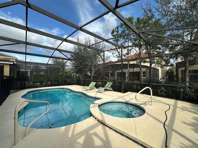 view of swimming pool with a patio area, glass enclosure, and an in ground hot tub