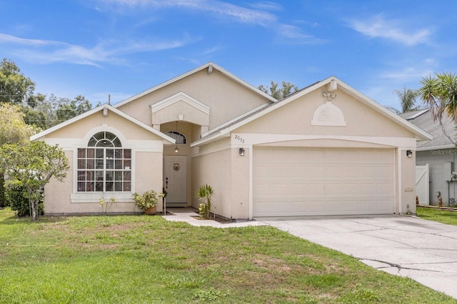 ranch-style home with a garage and a front lawn