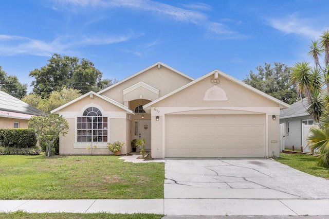 view of front of house with a front lawn and a garage