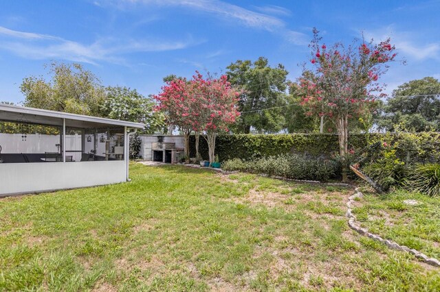 view of yard with a sunroom