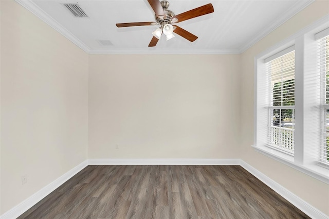 empty room featuring ceiling fan, dark hardwood / wood-style flooring, and ornamental molding