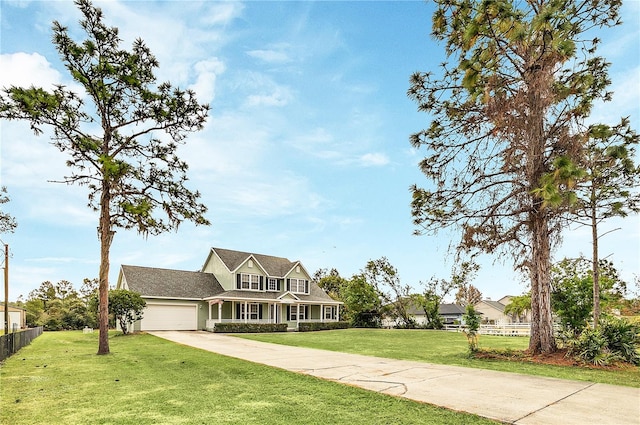 view of front of home featuring a front yard and a garage