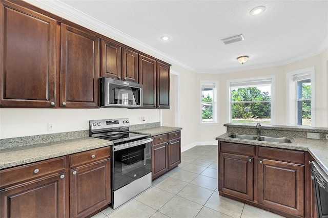 kitchen with sink, ornamental molding, stainless steel appliances, and light tile patterned floors