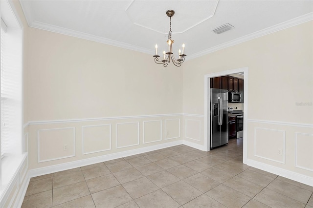 tiled empty room featuring ornamental molding and a notable chandelier