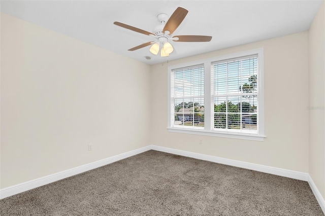 spare room featuring carpet flooring and ceiling fan