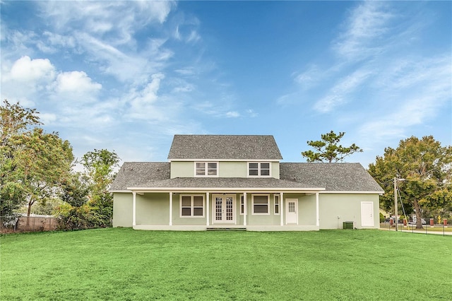 back of house featuring a yard and cooling unit