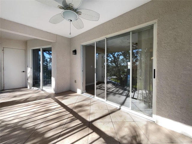 exterior space featuring ceiling fan