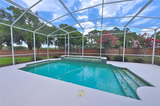 view of pool featuring a lanai and a patio area