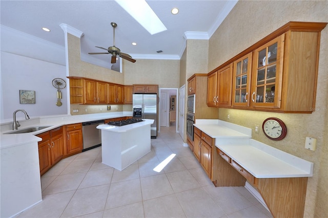 kitchen featuring appliances with stainless steel finishes, ceiling fan, crown molding, sink, and light tile patterned flooring