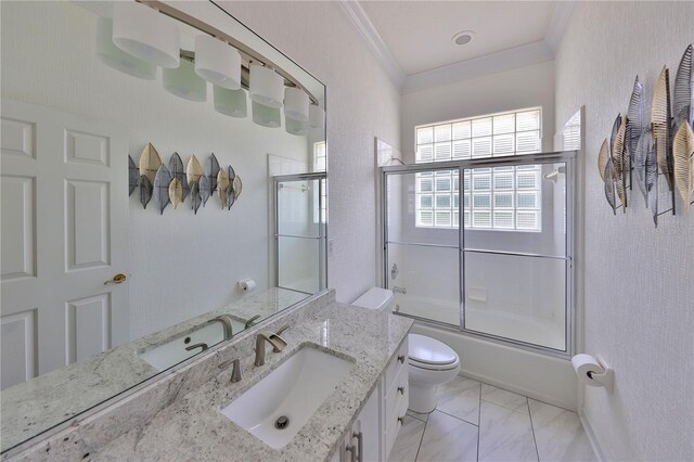 full bathroom featuring toilet, vanity, combined bath / shower with glass door, and ornamental molding