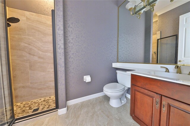 bathroom with vanity, an enclosed shower, and toilet