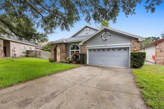 ranch-style home with a front yard and a garage