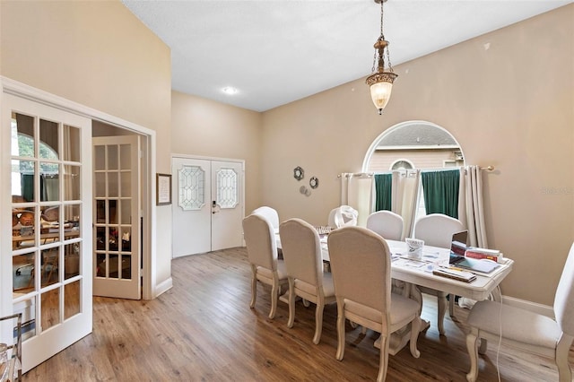 dining area featuring hardwood / wood-style floors and french doors