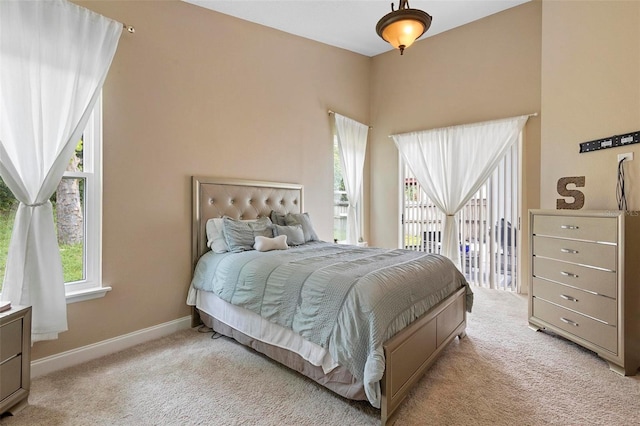 bedroom with light colored carpet