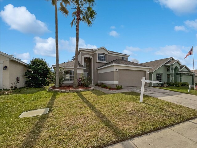 front facade with a garage and a front yard