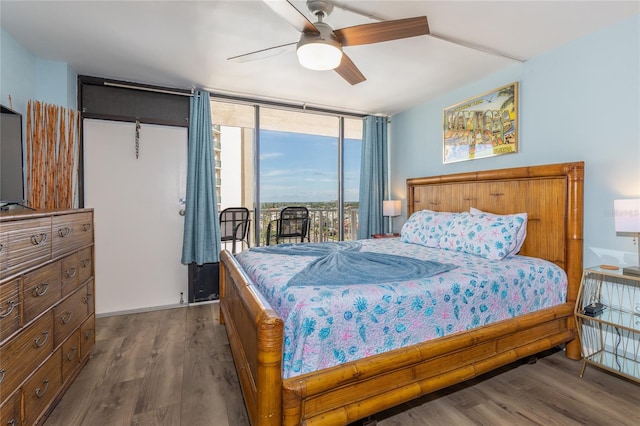 bedroom featuring ceiling fan, access to outside, and wood-type flooring