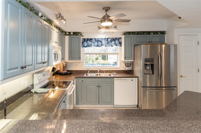 kitchen featuring ceiling fan, white appliances, and sink