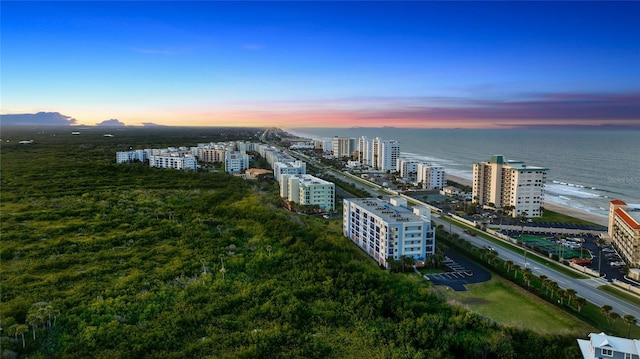 aerial view at dusk with a water view