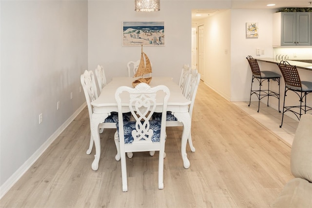 dining space with light wood-type flooring