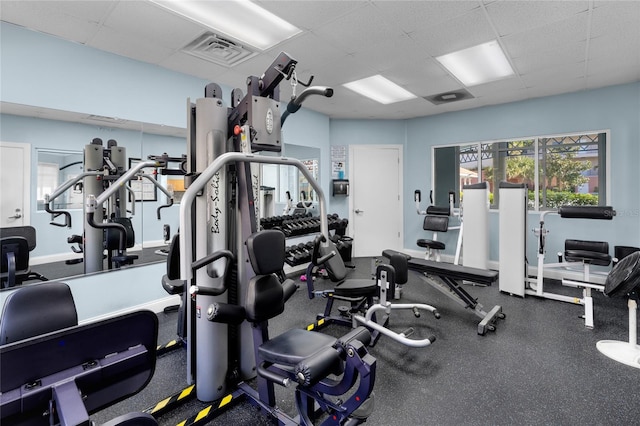 workout area featuring a drop ceiling