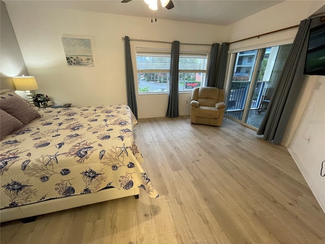 bedroom with access to exterior, wood-type flooring, and ceiling fan