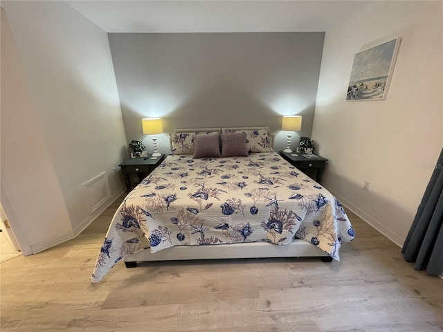 bedroom with light hardwood / wood-style flooring