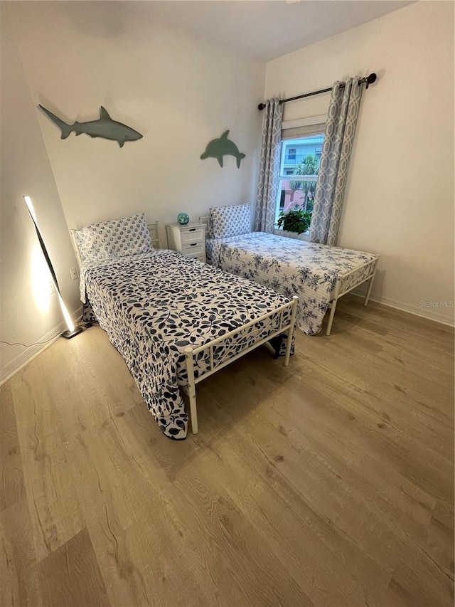 bedroom featuring wood-type flooring