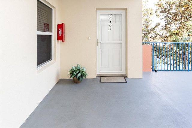 property entrance with a balcony