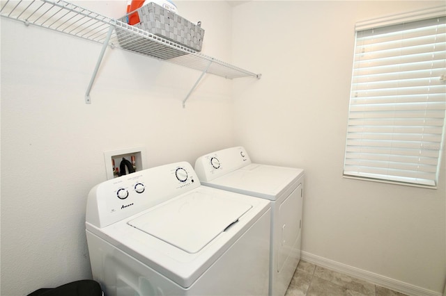 laundry room featuring washing machine and clothes dryer