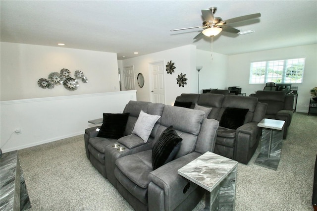 carpeted cinema room featuring ceiling fan