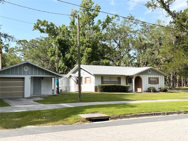 single story home with a garage and a front lawn