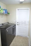 clothes washing area featuring washer and dryer