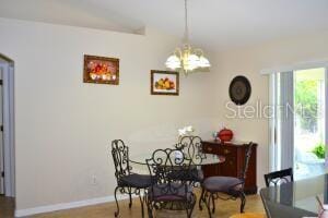 dining room featuring a notable chandelier