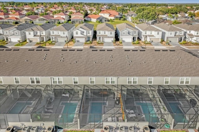 birds eye view of property with a residential view