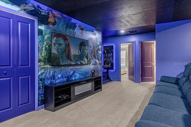 home theater featuring visible vents and carpet flooring