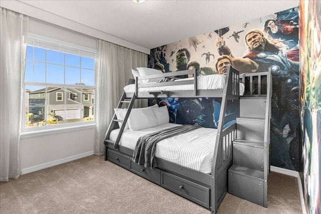 bedroom featuring carpet floors, baseboards, and wallpapered walls