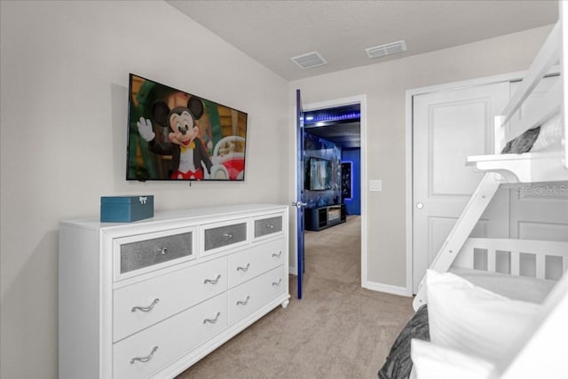 bedroom featuring light colored carpet