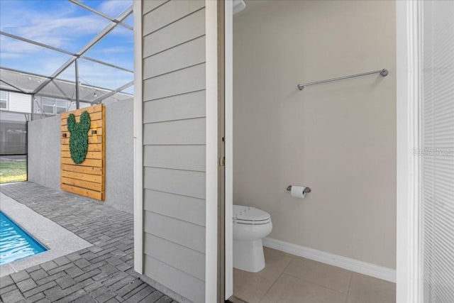 bathroom featuring toilet and tile patterned floors