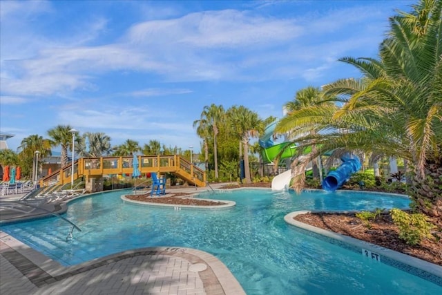 view of swimming pool featuring a water slide