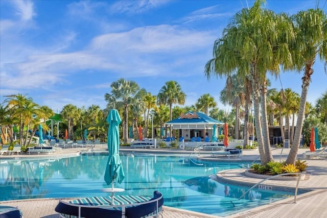 community pool with a patio area